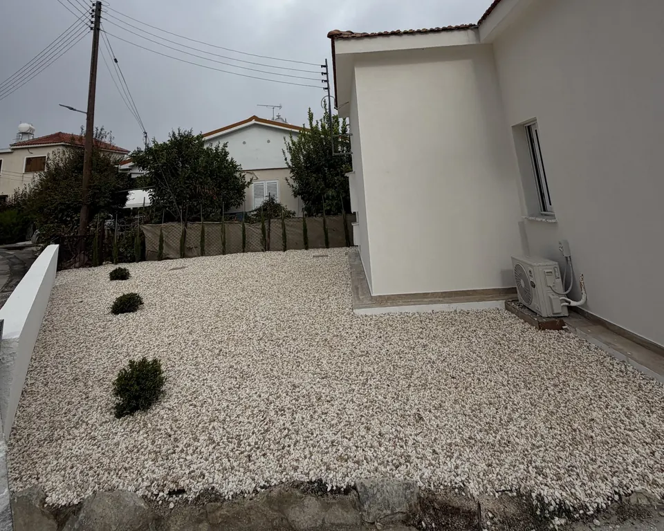 New stone yard with shrubs
